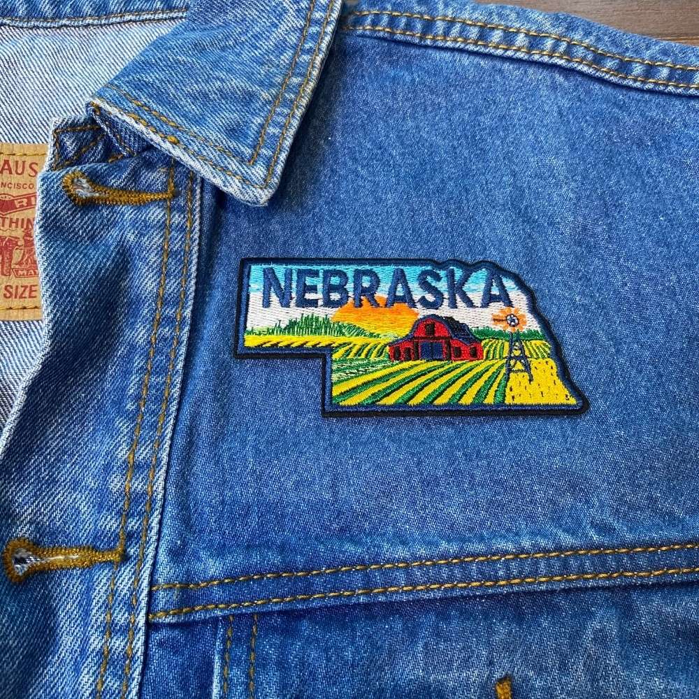 Nebraska Patch on a backpack – iron-on embroidered patch