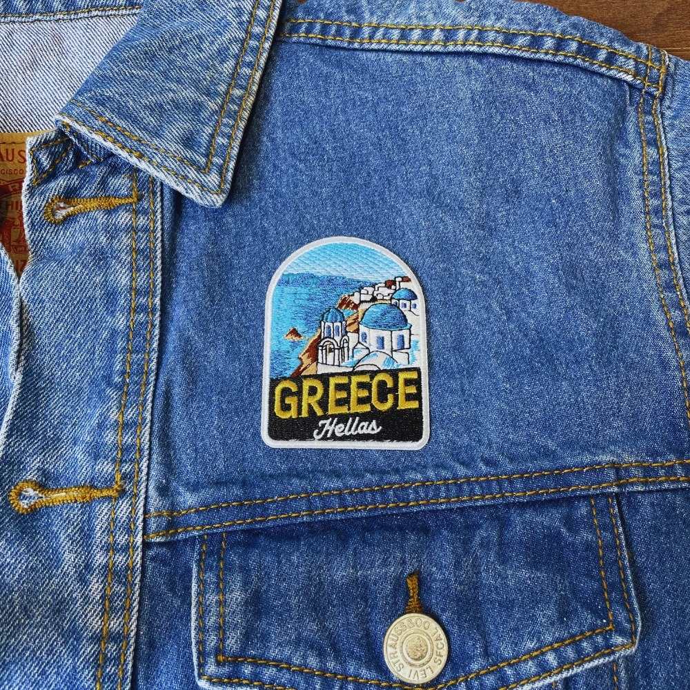 Blue Dome Greece Patch on a backpack – iron-on embroidered patch