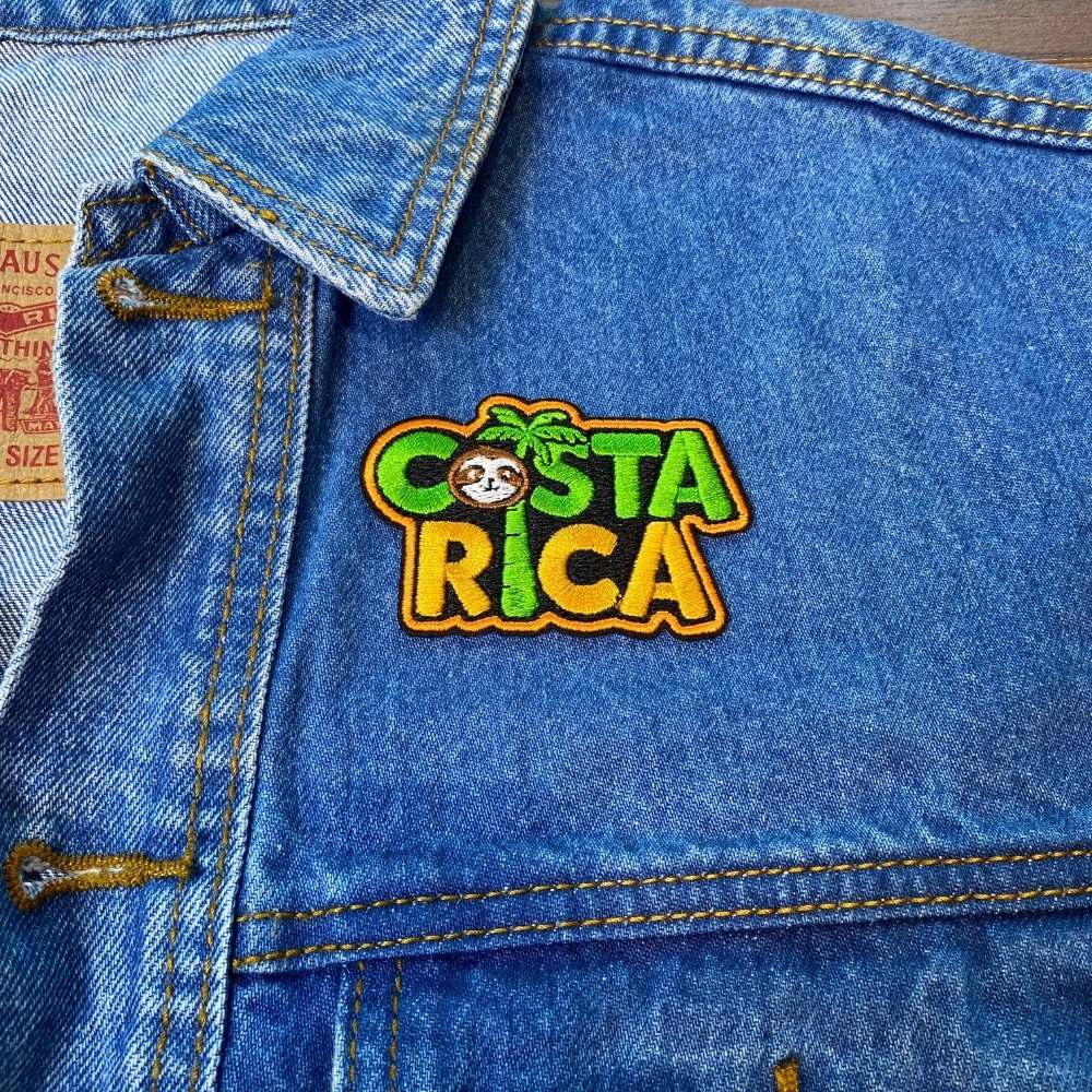 Sloth Adventure Costa Rica Patch on a backpack – iron-on embroidered patch